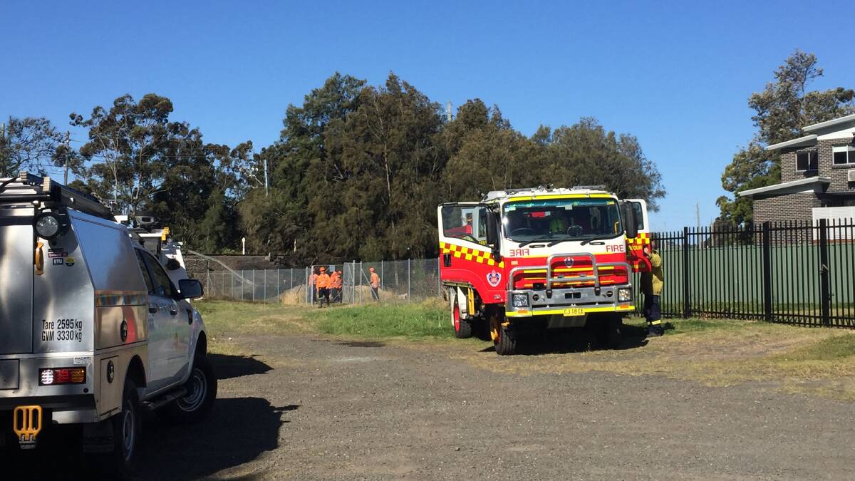 Emergency services on scene at a grass fire in Albion Park Rail on Wednesday. Picture: Sylvia Liber