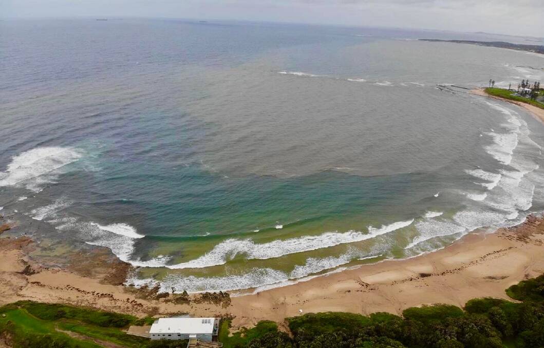 A number of Illawarra beaches remained closed on Sunday due to significant storm-water run off. A birds eye view of Sandon Point beach showing storm water run off and poor water clarity on Sunday. Picture: Sandon Point SLSC