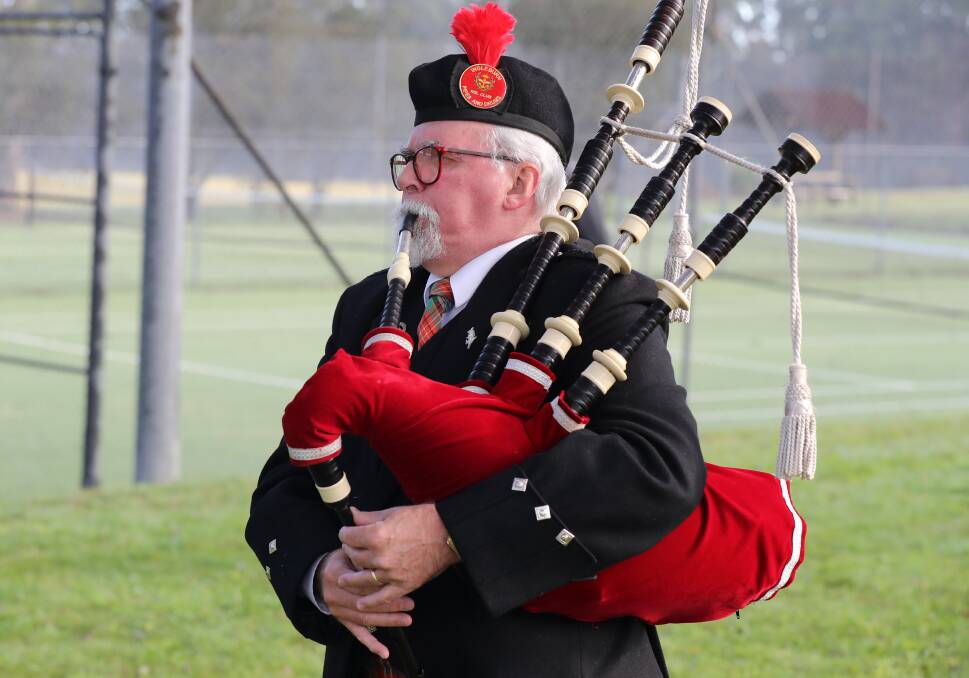Bagpiper Alan Harris lead the service and concluded in Appin on Sunday. Picture: Robert Peet
