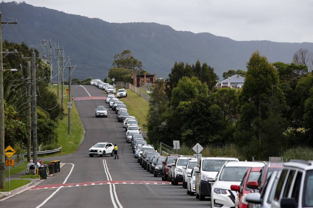 Detours and police traffic control were implemented to deal with the large numbers of people heading to the pop-up clinic in Woonona on Monday. Pictures: Anna Warr