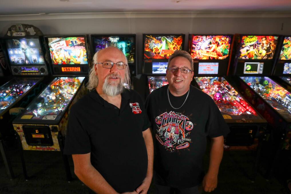 Illawarra Pinball Club president Rob Rusak with Paul Soutter (treasurer) in the new pinball room that anyone can use. Picture by Adam McLean.