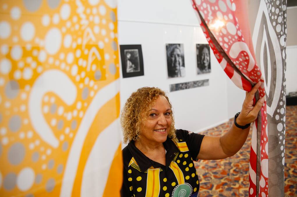 Errolyn Strang with artworks at the Illawarra Aboriginal Culture Centre. The exhibition is part of the Aboriginal Art Trail which is on at the moment. Picture: Anna Warr