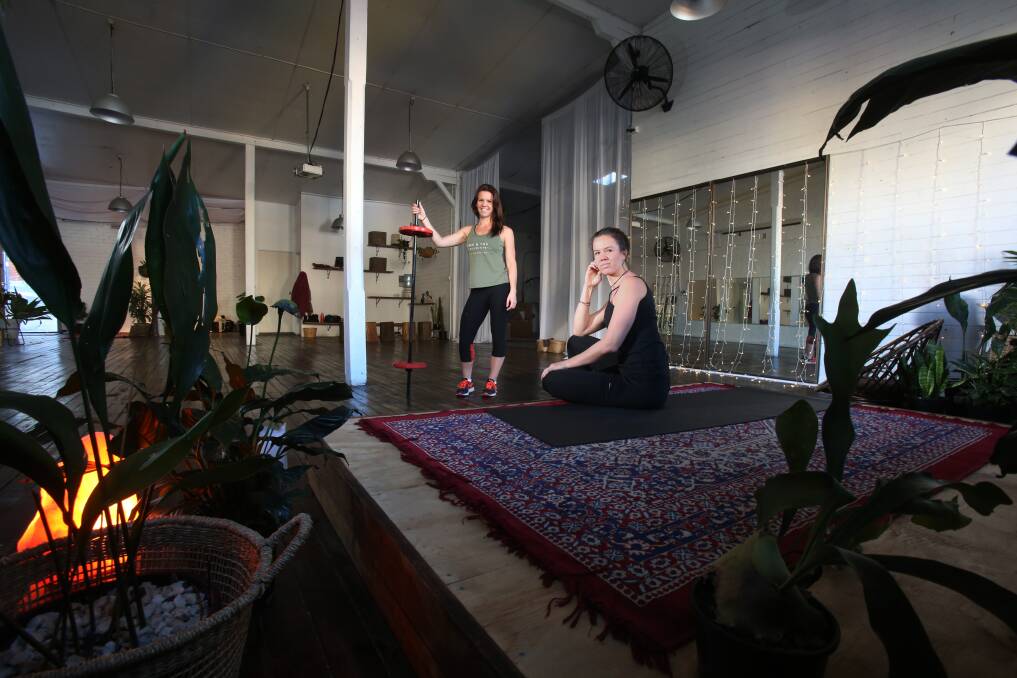 TWO AND YOU COLLECTIVE: Sisters Taylor and Cydney Atkins have opened a yoga and fitness studio which has a non-for-profit side aimed at connecting people in the community. Picture: Robert Peet