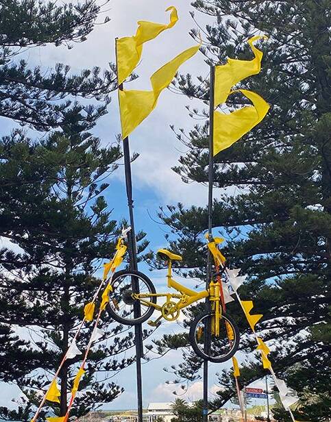 Kiama Council and Destination Kiama are encouraging residents and spectators to wave yellow flags or wear yellow in support of the riders. Picture: Supplied