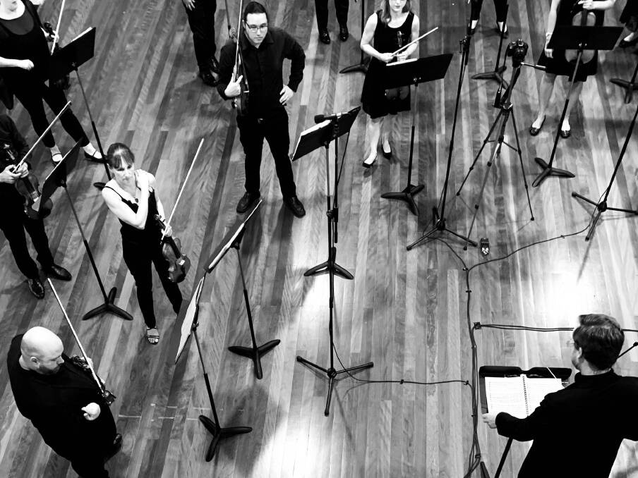 NO DESK SHARING: Socially-distanced Steel City Strings musicians recording under the baton of Luke Spicer at Berry School of Arts over the weekend. Picture: Supplied