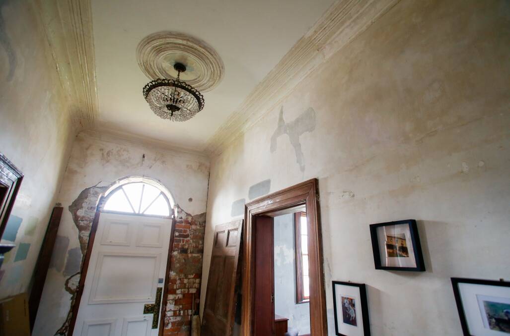 The family had to use razor blades to scrape off modern day paint from the original plaster. 