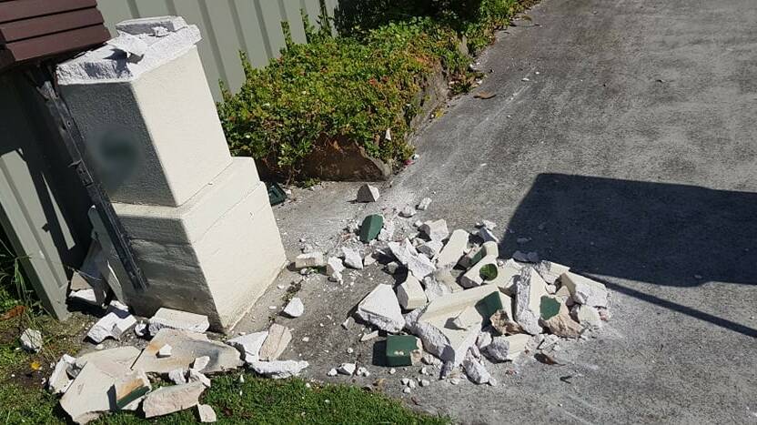 The residents of this Thirroul home work to an explosion, with CCTV revealing a number of hooded men in their front yard. Police are yet to make any arrests but say investigations are ongoing. Picture: Supplied