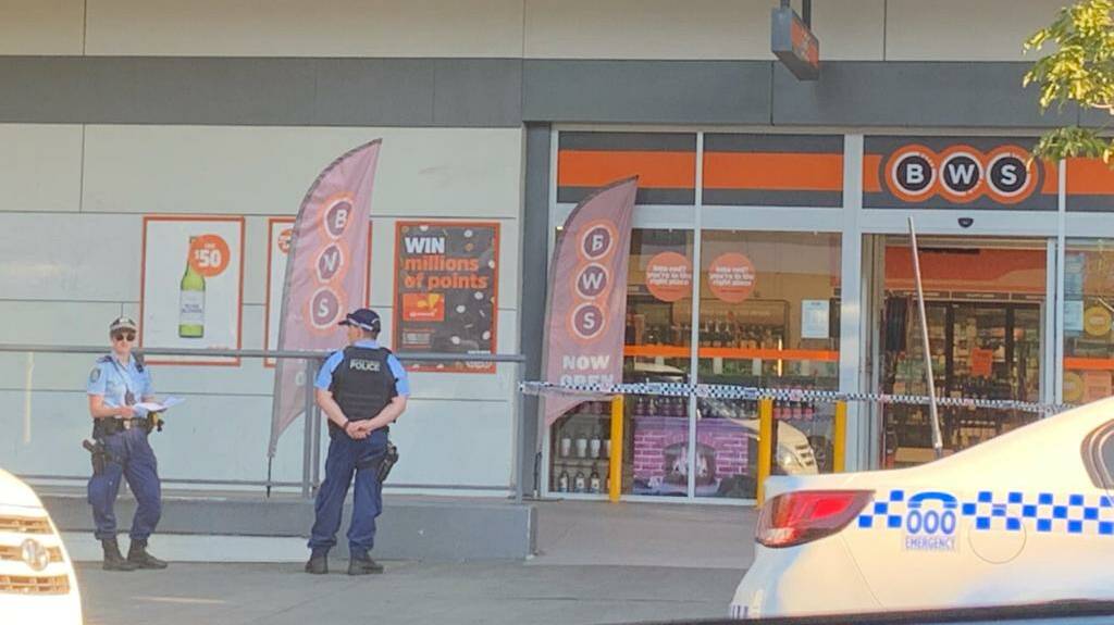 Police remain at the scene of an armed hold-up on Monday. Picture: Cydonee Mardon