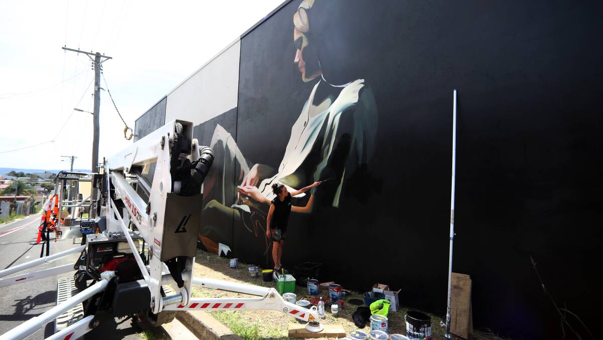 Flashback: Loretta Lizzio works on her artwork, located along Military Lane at Port Kembla, Februay 2019. Picture by Sylvia Liber.