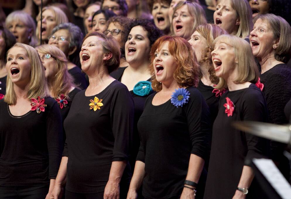 ALL FOR THE CAUSE: One of Sydney's Hummingsong choirs performing recently. Money raised from performance helps women's organisations and refuges. To join or more details: www.hummingsong.com.au Picture: Supplied
