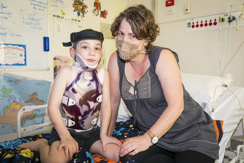 ETERNALLY GRATEFUL: Vincent suffered a 'severe brain injury' and is currently getting around in a body brace, but mum Clare Bate says 'he's on track to getting back to his old self'. Picture: Sydney Children's Hospital