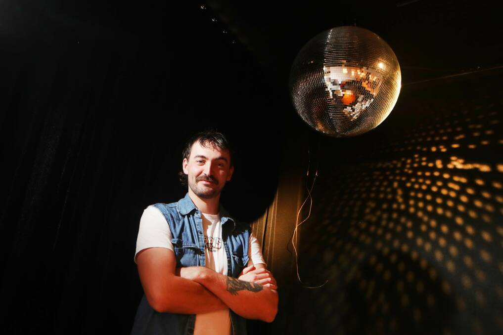 Kiama local Ashley O'Neill is happy they've kept the sparkly disco ball at Bar Padres, which is in place where the Little Blowhole Art Bar used to be on Tingira Street. Picture: Sylvia Liber