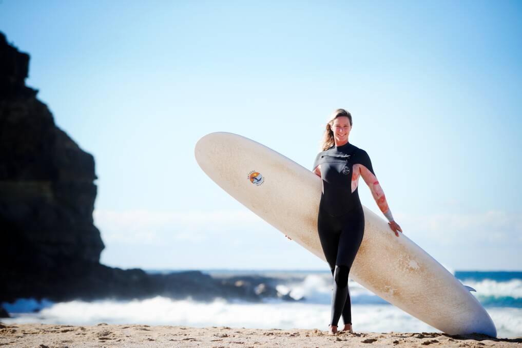 Surfing mama Juliana Scopel says looking graceful and "cross-stepping" along a longboard was harder than she first through and a massive balancing act - but she's now got the knack. Picture by Sylvia Liber