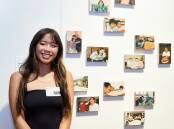 Kya Stawski from Corpus Christi Catholic High School with her series of paintings titled, 'When You Were Born'. Picture supplied.