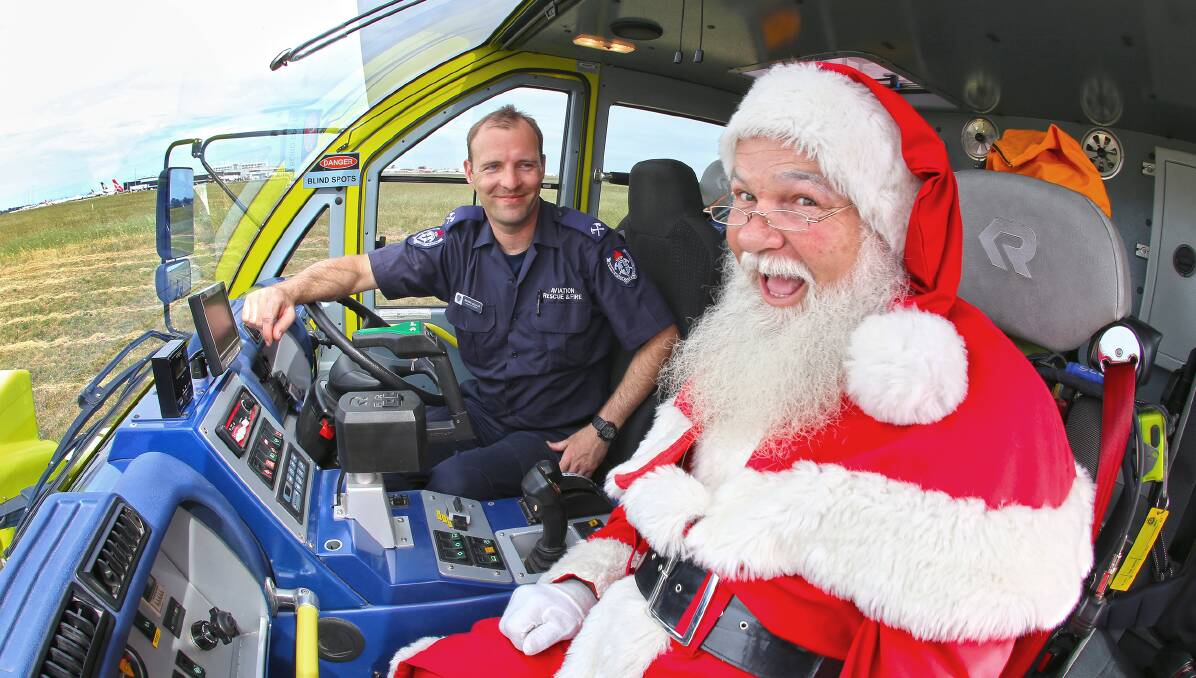 Santa checked out an Mk8 Panther ultra-large fire vehicle earlier in the week with aviation fire fighter Michael - all part of safety checks ahead of his big night. Picture: Airservices Australia