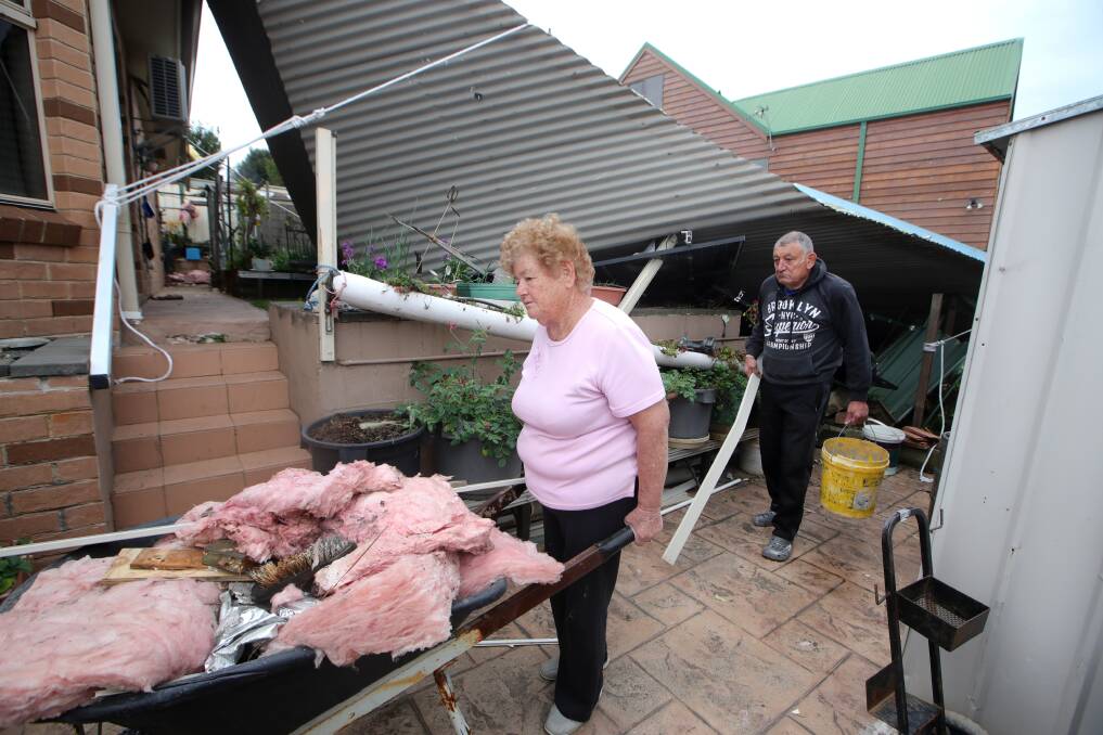 STORM DAMAGE: Monty and Carmen Portelli at their Flinders home in August after a severe wind storm blew the roof of their house. Picture: Sylvia Liber