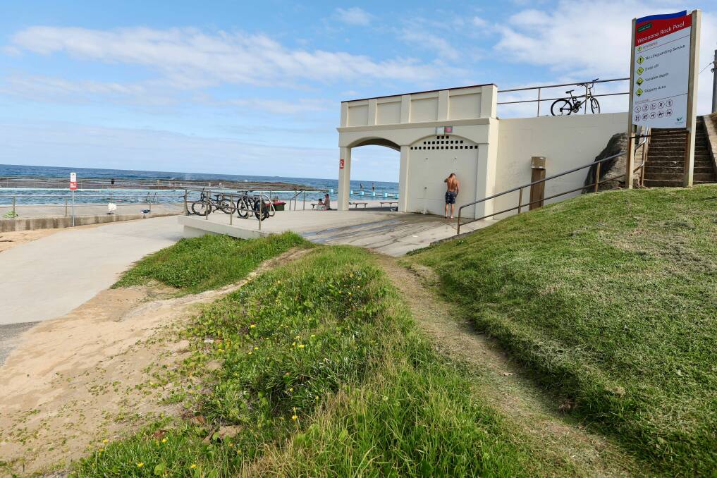 Woonona ocean pool has a disabled toilet but it has three stairs leading up to it, or the alternative is to go up a ramp then along a thin grass track and onto a wet and sandy surface to access it. Picture by Adam McLean.