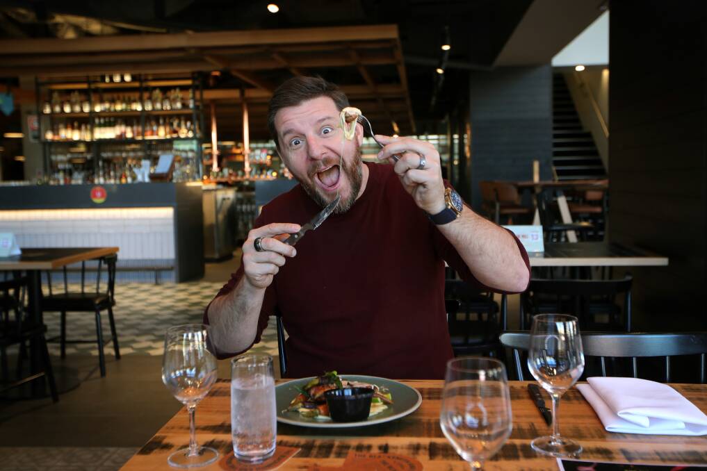 BIG DEAL: Television chef Manu Feildel taste tests the signature dish at The Mill in Dapto Leagues Club on Wednesday. Picture: Sylvia Liber