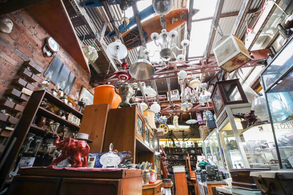 Russell Hall says a lot of the items at Wombat in Thirroul are brought in by people decluttering or selling their homes. Picture by Adam McLean.