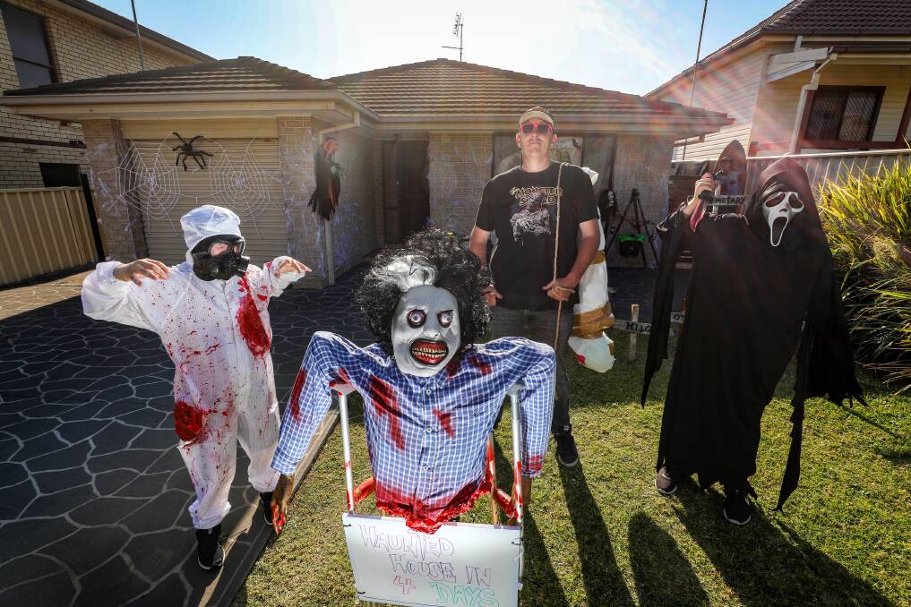 Josh Smith with his children Cruize, 8 and Amari, 11, will transform their Port Kembla house on Second Ave into a haunted maze Halloween. Picture by Adam McLean