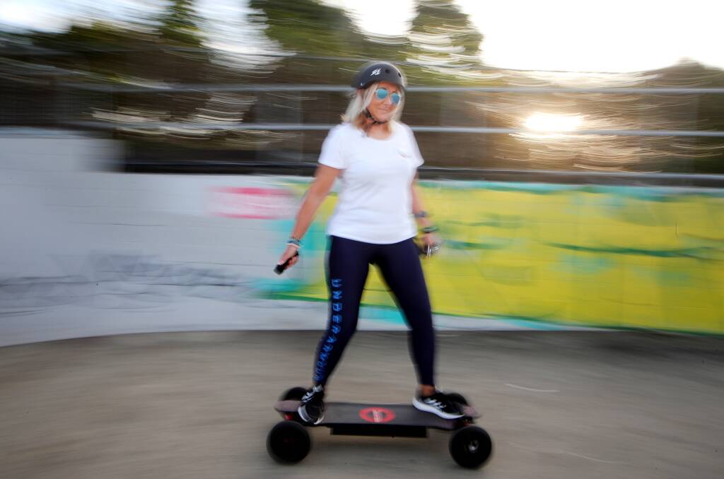 Mila Evans, 53, swapped farm life for Kiama just before the pandemic. She took up skateboarding, surfing and other outdoor sports to help ease the stress of lockdowns and has never looked back. "I'd just wish id done all this earlier in life," she says. Picture: Sylvia Liber