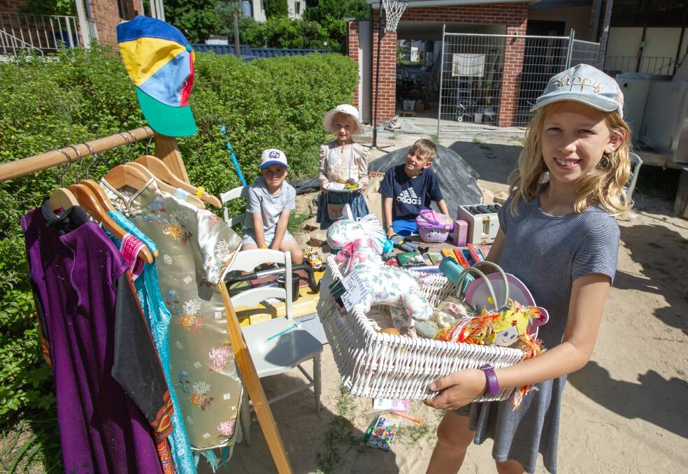 Jack Hardwicke 6, Tilly McKay 6, Abel Hardwick 8 and Jemima McKay 10, with their garage sale take part in the national Garage Sale Trail, encouraging people to sell their unwanted items rather than letting them end up in landfill. Picture: Elesa Kurtz - THE CANBERRA TIMES, ACM