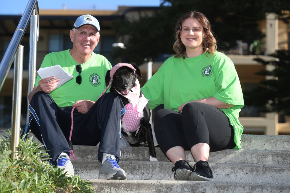 Brad Hanns with his therapy dog Shadow, dressed as Barbie, and carer Abbey Pabis. Brad and his pooch currently help organise Dogs in the Park Festival events across NSW. Picture by Robert Peet