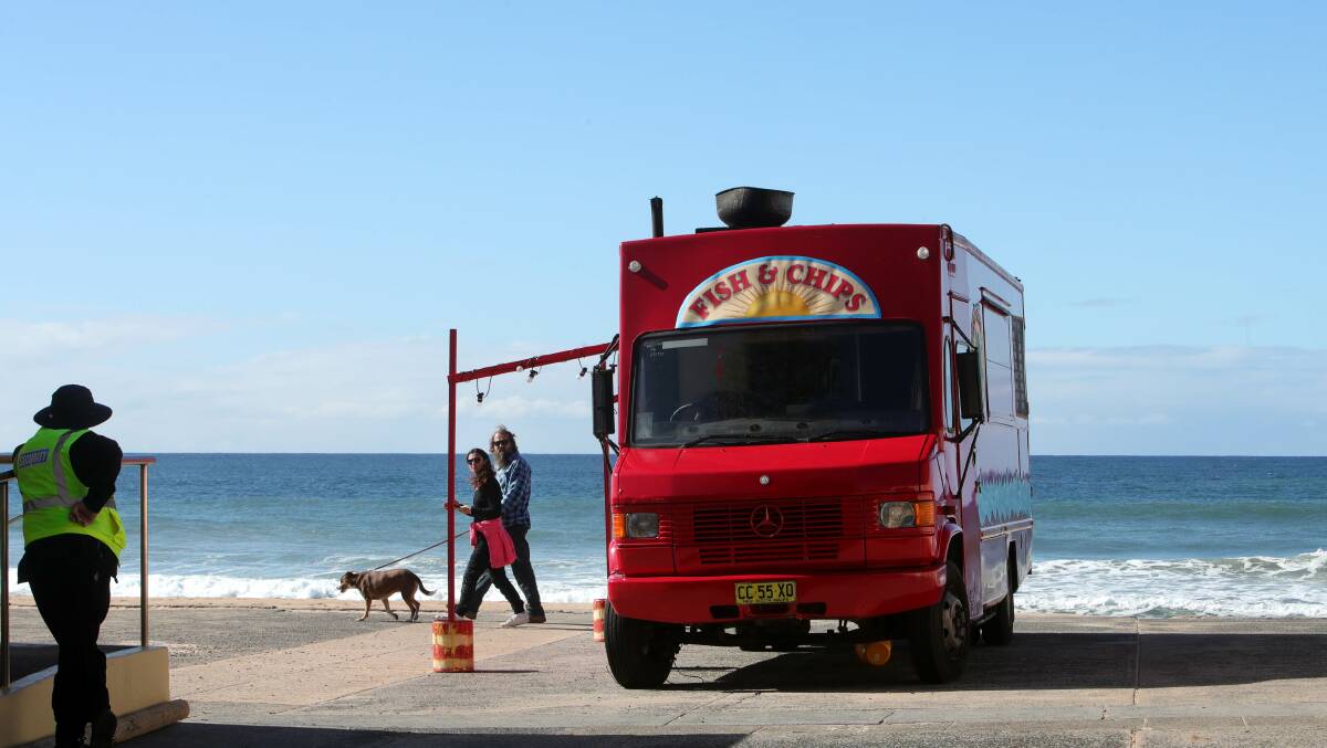 A WRAP: Princess Productions film their last scenes in Thirroul on Wednesday night at Thirroul beach with fake fish'n'chips van set. Picture: Sylvia Liber