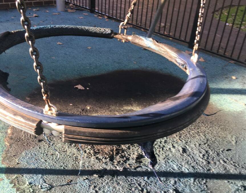 Vandals set fire to a swing at Luke's Place playground in Corrimal recently. Picture: Facebook