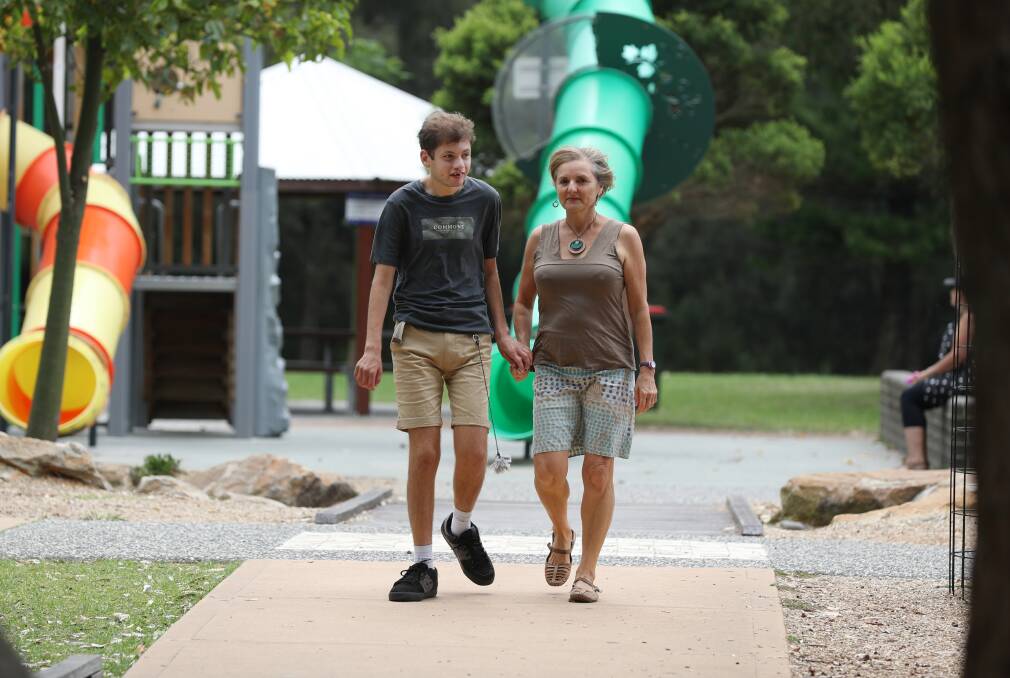 Dr Shoshana Dreyfus and her 25-year-old son Bodhi Dreyfus-Ballesi at Stuart Park, which will be extended to include a new playground for adults with disabilities. Picture: Robert Peet