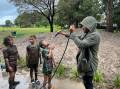 SATURDAY SPORT: The Woonona Bulli Bushrangers Under 9 team get hosed down after a very muddy match on Saturday, May 21. Picture: Anna Warr