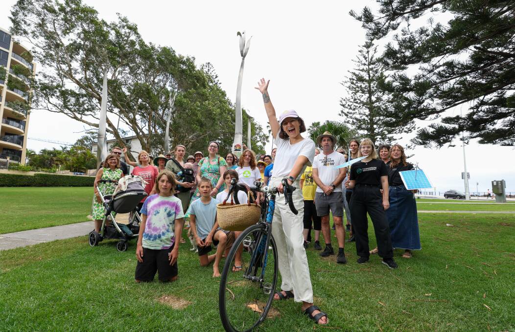 Courtney "Coco" Venaglia (white shirt with bike) with people from the Yes 2 Renewables Alliance ahead of a family-friendly climate action event on Sunday February 4. Picture by Adam McLean.
