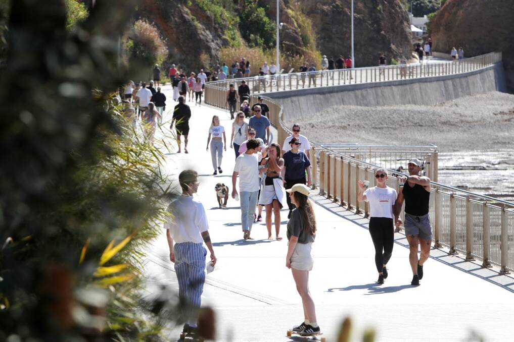 LAST WEEK: People out and about along the Blue Mile in Wollongong on August 21. Two nearby businesses have been listed as COVID exposure sites for that weekend. Picture: Sylvia Liber