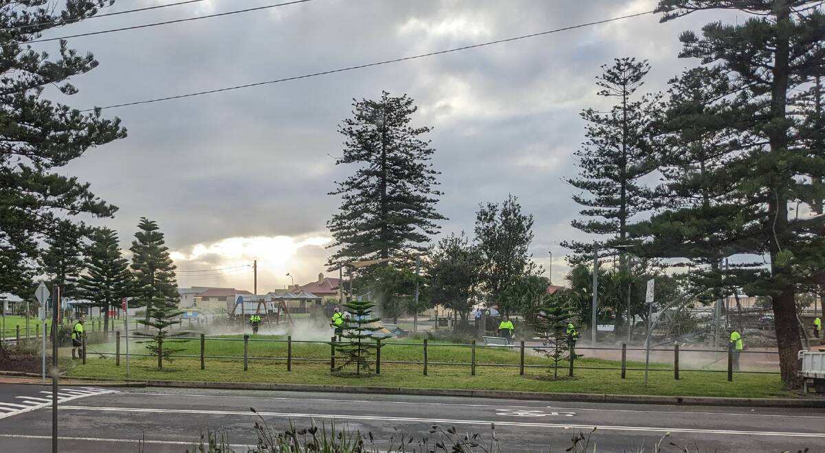 Wollongong City Council workers were out in force on Wednesday morning using every tool available to tidy broken branches at Thirroul beach Reserve and cut grass with whipper-snippers ahead of more wild weather forecast for later in the week. Picture: Supplied