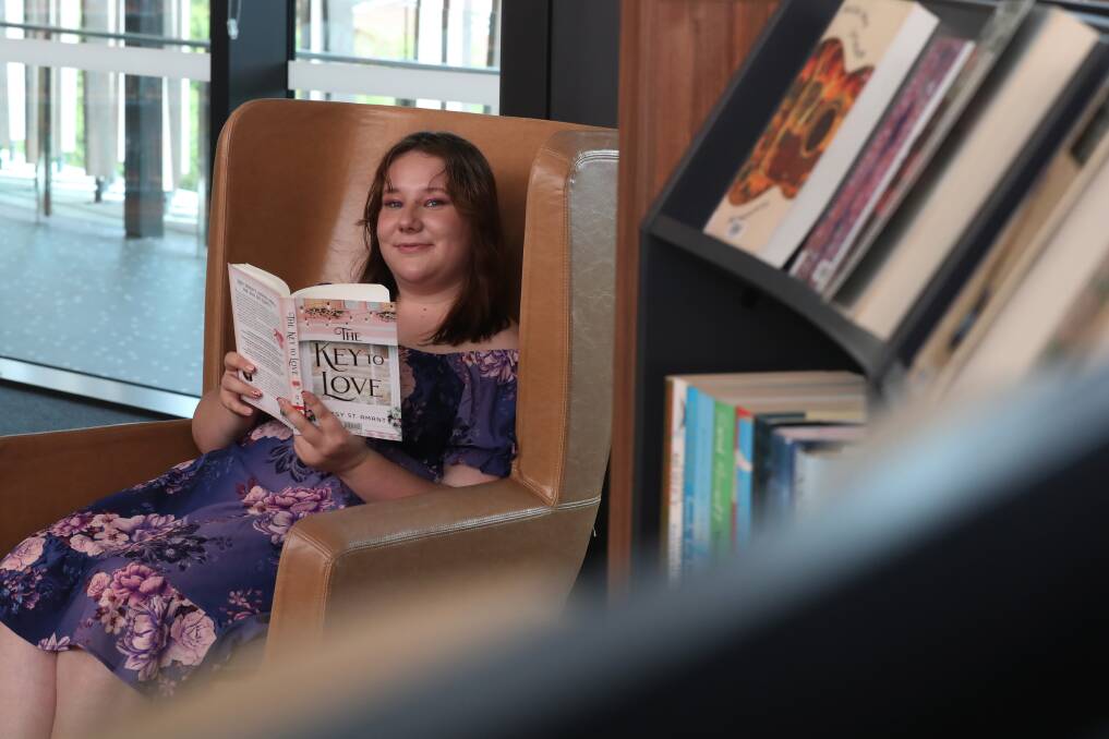 Albion Park resident Olyvia Ryan loves romance books and has so far read 160 novels this year, but is hoping to beat her last year's record of 207. Picture by Robert Peet