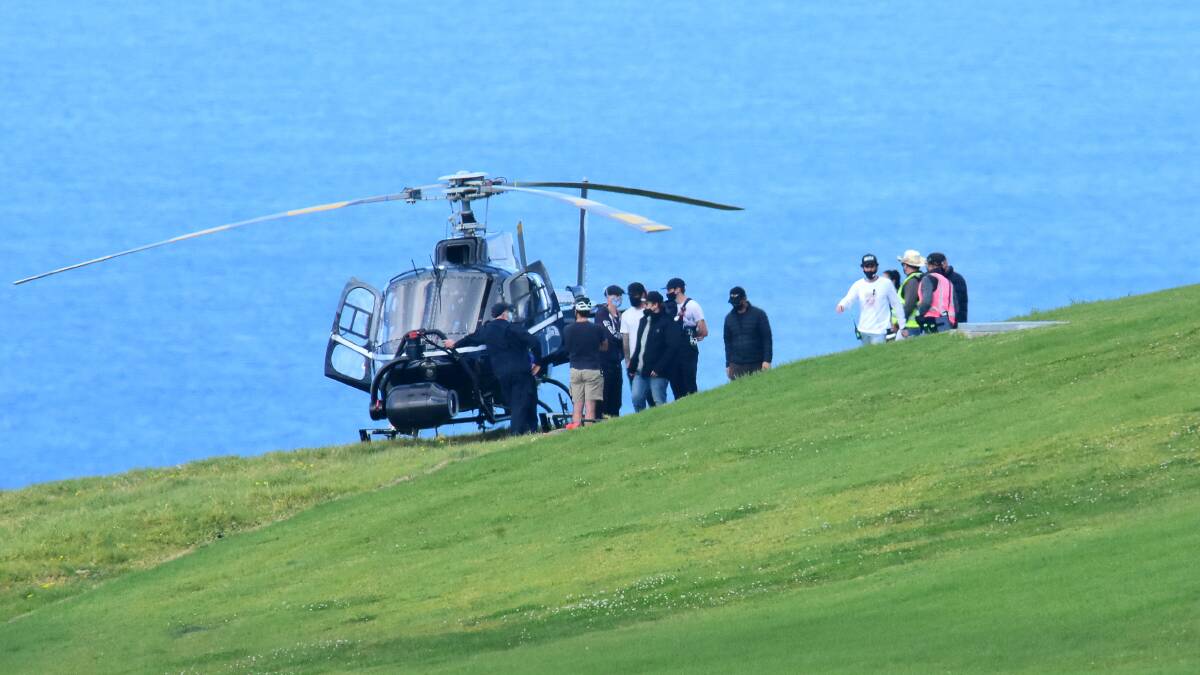 JUST LANDED: A-listers get off a private helicopter at the prestige property in Kiama where Russell Crowe is filming his latest movie, expected to be Poker Face with Liam Hemsworth and Elsa Pataky. Picture: Sylvia Liber