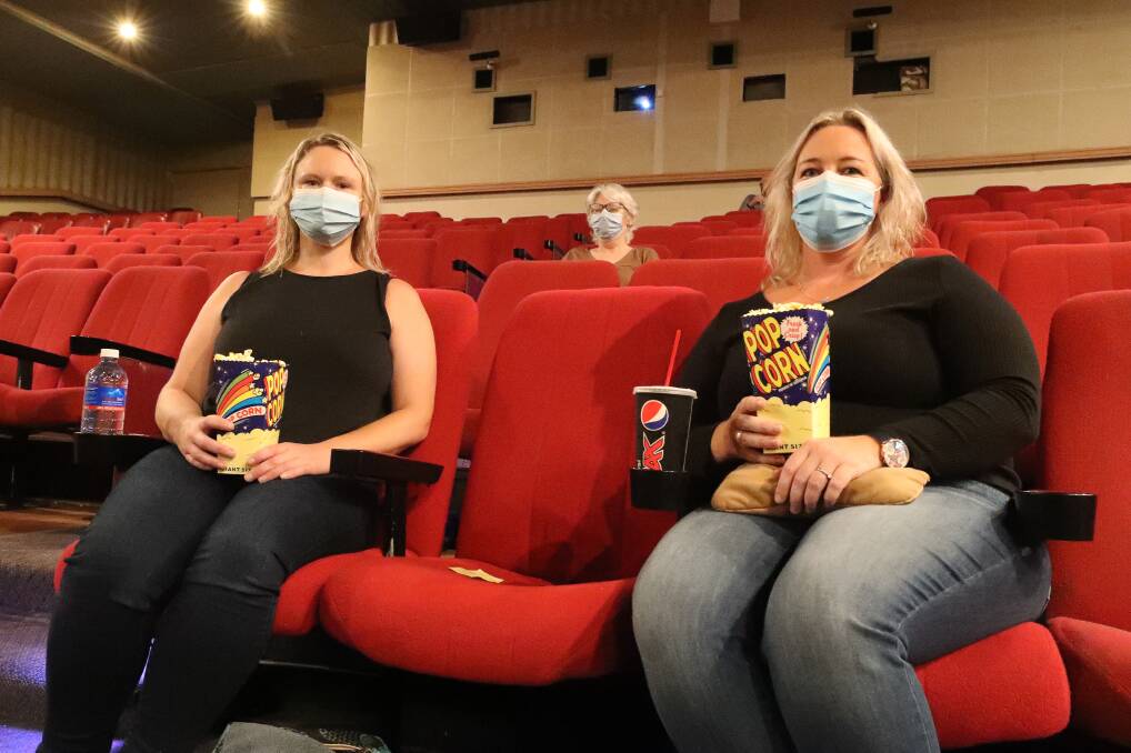 Robyn Savill, Tricia Fortescue and Michelle Wiley about to watch The Flood at Warrawong's Gala Cinema on Sunday. Picture: Robert Peet