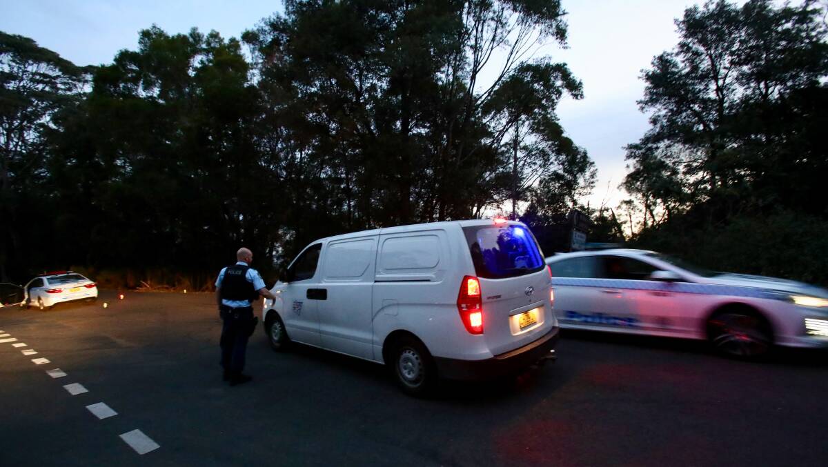 A NSW Police Forensics on the way to the scene of a serious crash at Mount Keira on Wednesday. Picture: Adam McLean