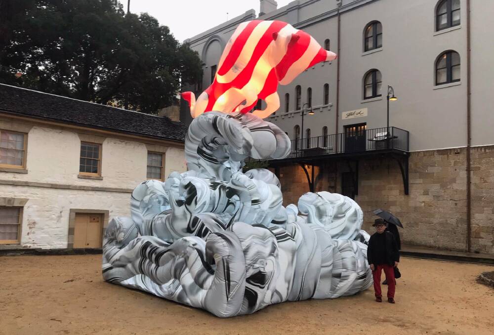 Laurens Tan and his Ox Lunar Lantern in front of Cadmans Cottage at The Rocks. It will remain on show until February 10. Picture: Supplied