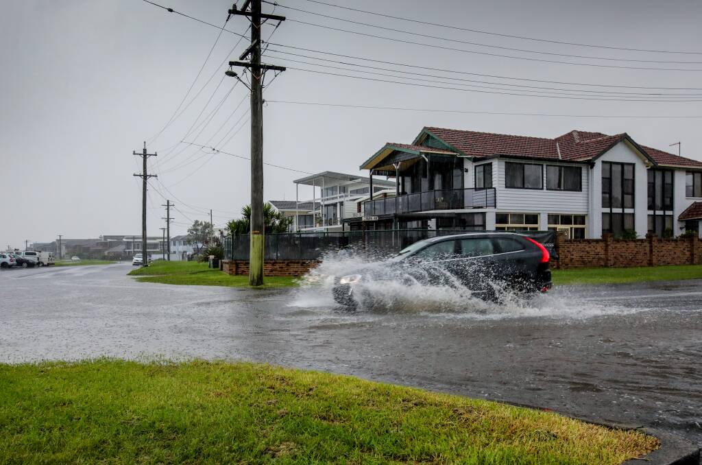 TORRENTIAL RAIN: Authorities advise to never drive through flood water. The northern Illawarra was hit by a rain bomb on Saturday causing flash flooding in parts of Thirroul and Woonona (like the above Park Road). Picture: Wesley Lonergan