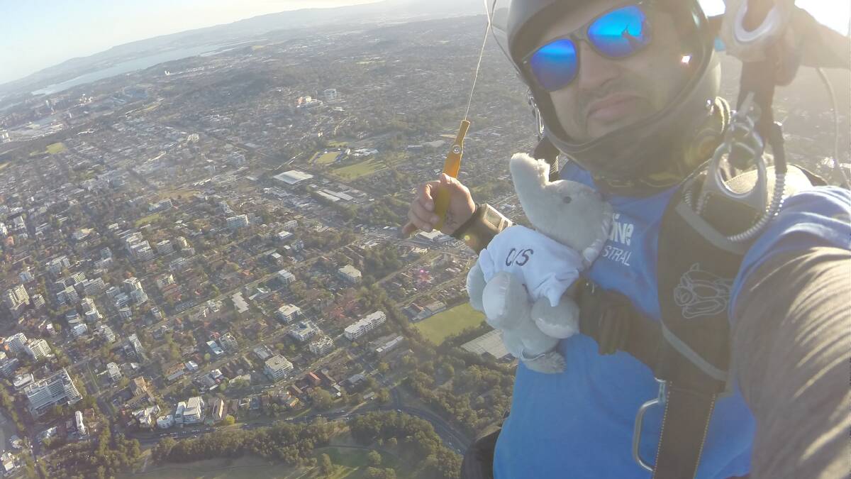 Ellie the Emesis Elephant and skydiver John Martin on Sunday. Picture: Supplied