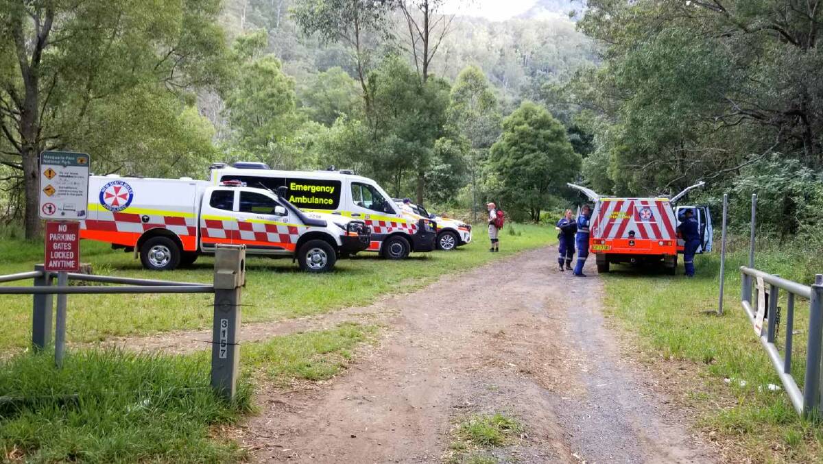 Emergency services setup a base of the Macquarie Pass Jump Rock walking trail on Sunday. It took paramedics 25 minutes to reach the patient on foot. Picture: Mandy Liu