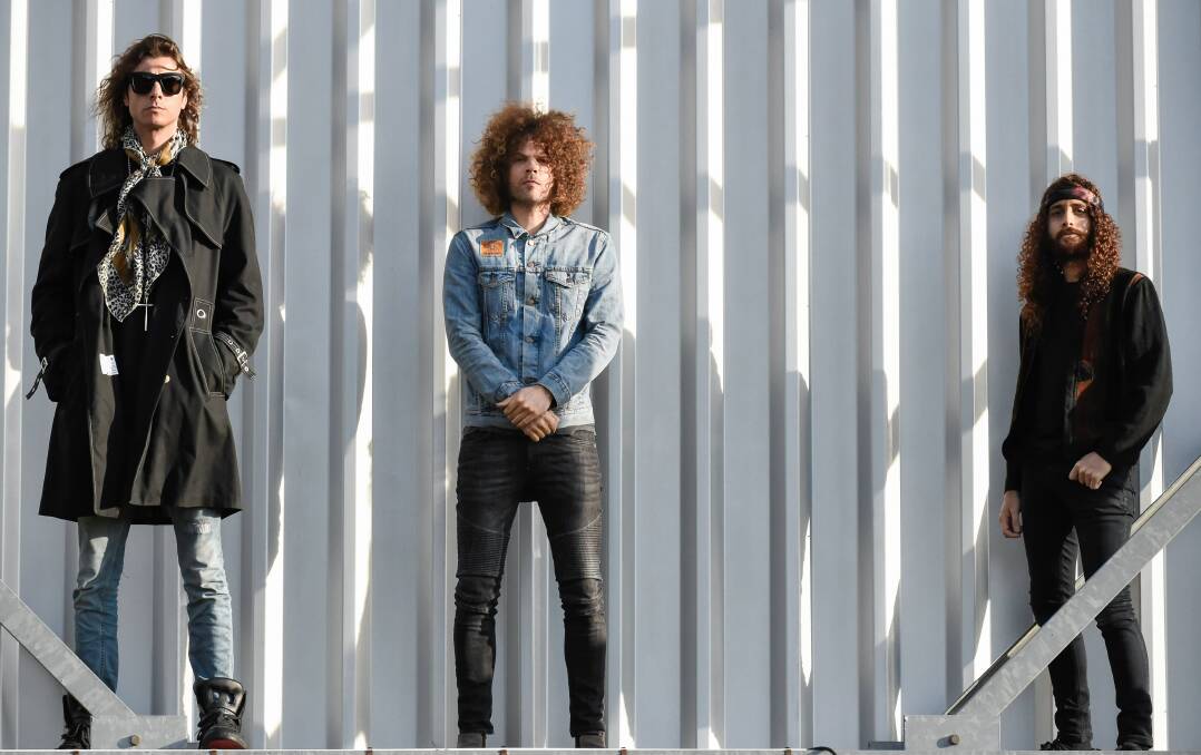 WOLFMOTHER: Andrew Stockdale (middle) says he's happy to no longer be contracted to a label and able to release his music independently through his YouTube channel 'WolfmotherMusic'. Picture: Supplied