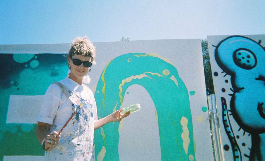 Nicci Bedson creating a live mural for Forever Projects at last year's Yours and Owls Festival in North Wollongong. Picture: Supplied