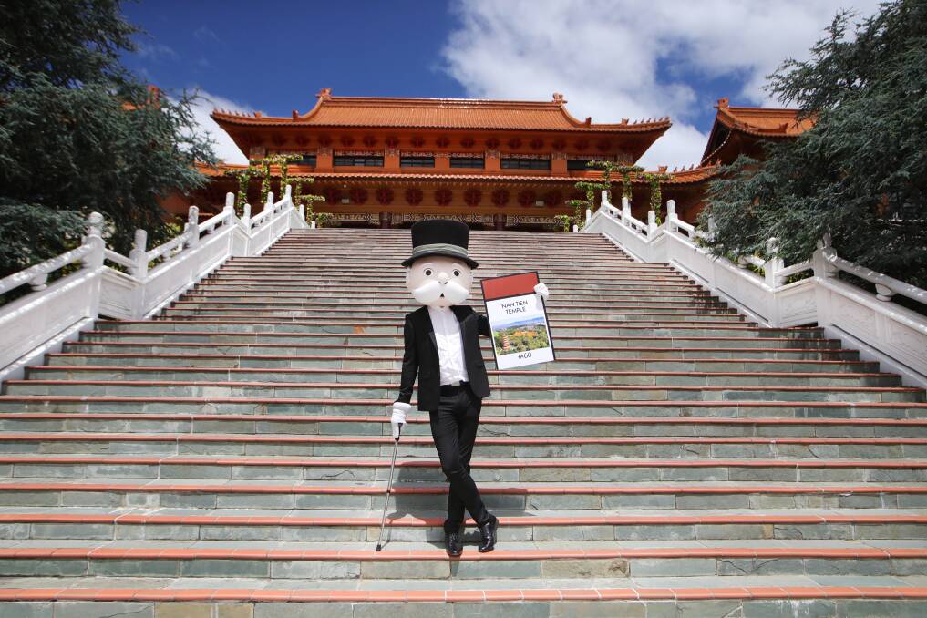 Mr Monopoly at Nan Tien Temple which will take one of the lowest value squares, brown. Picture: Sylvia Liber