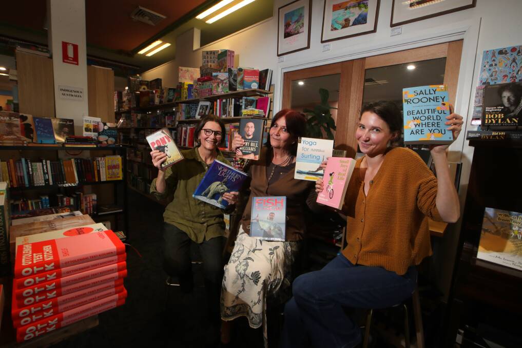 GREAT VIBE: There may have been the odd aggressive customer during lockdown for Collins Booksellers Thirroul, but it was all smiles and "thanks" for their first week of reopening - Deb Thompson, Amanda Isler and Kate Adams. Picture: Sylvia Liber