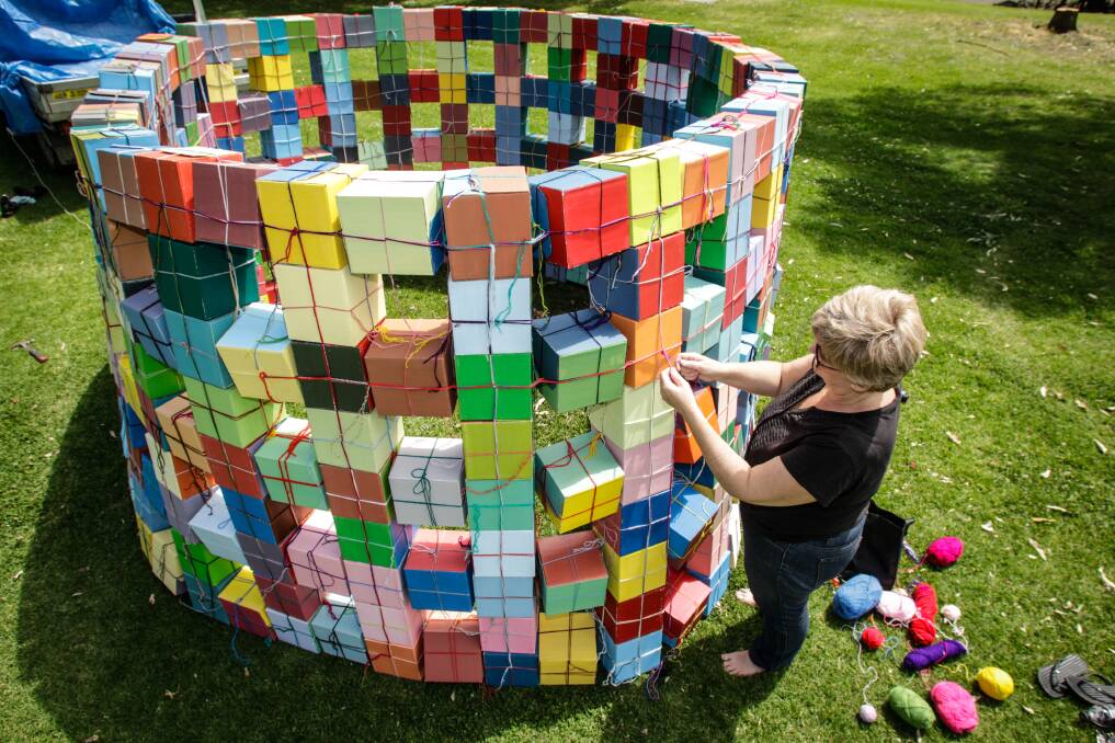 Artist Kate Mackay setting up 'Round Cube' for the Sculptures at Killalea festival beginning Wednesday at Shell Cove. Picture: Georgia Matts