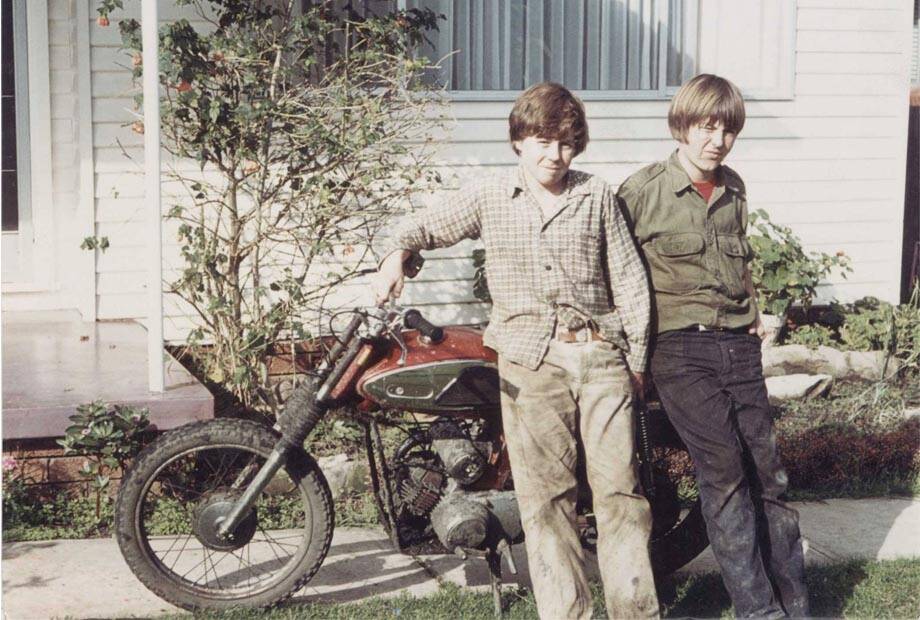 An archive photo from the documentary Wayne, of Wayne Gardner and friend with the first dirt bike the racing legend ever owned.