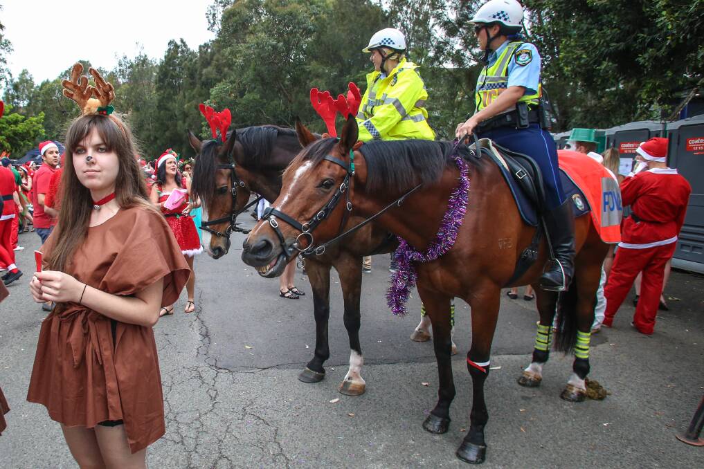 FLASHBACK: Mounted police keeping an eye on the 2013 Santa Claus Pub Crawl for charity. Picture: Adam McLean