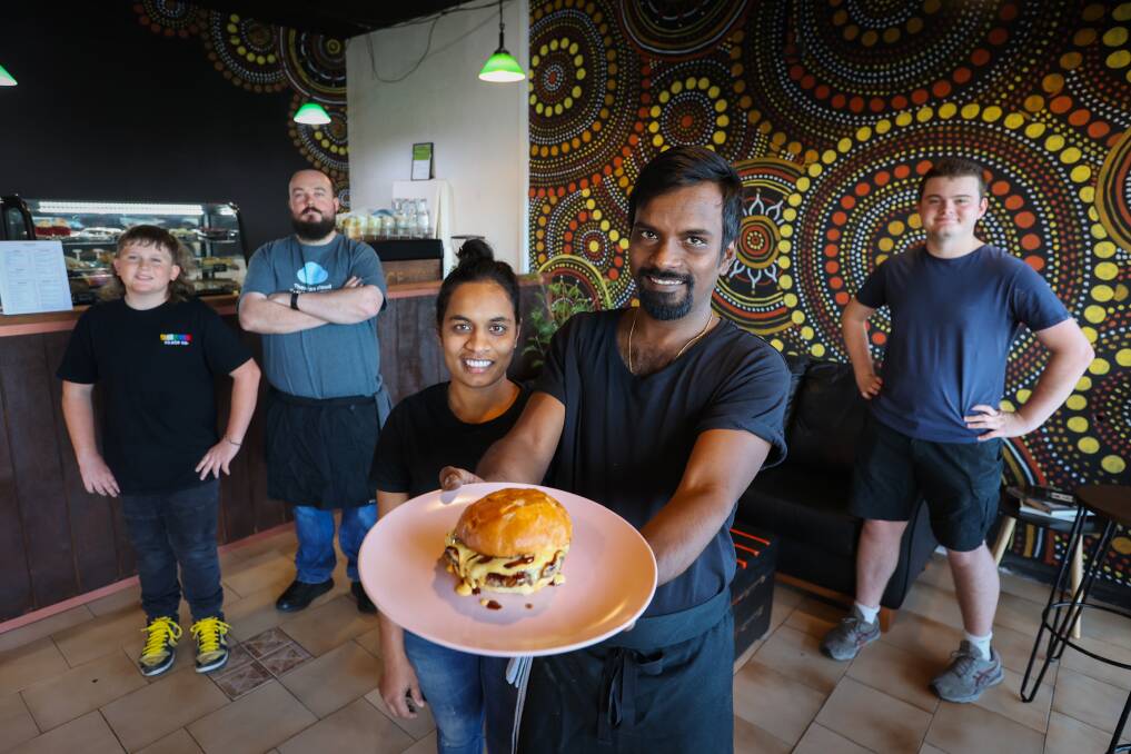 Entrepreneurs Nishita Koli and Goutham Arya Thota with some of their team at their spicy new burger joint, Sauce, opposite Figtree Grove shopping centre. Picture by Wesley Lonergan.